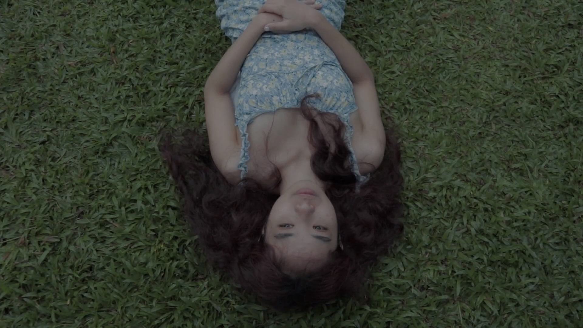 Fern Santos Lying On The Ground In Modern Stray